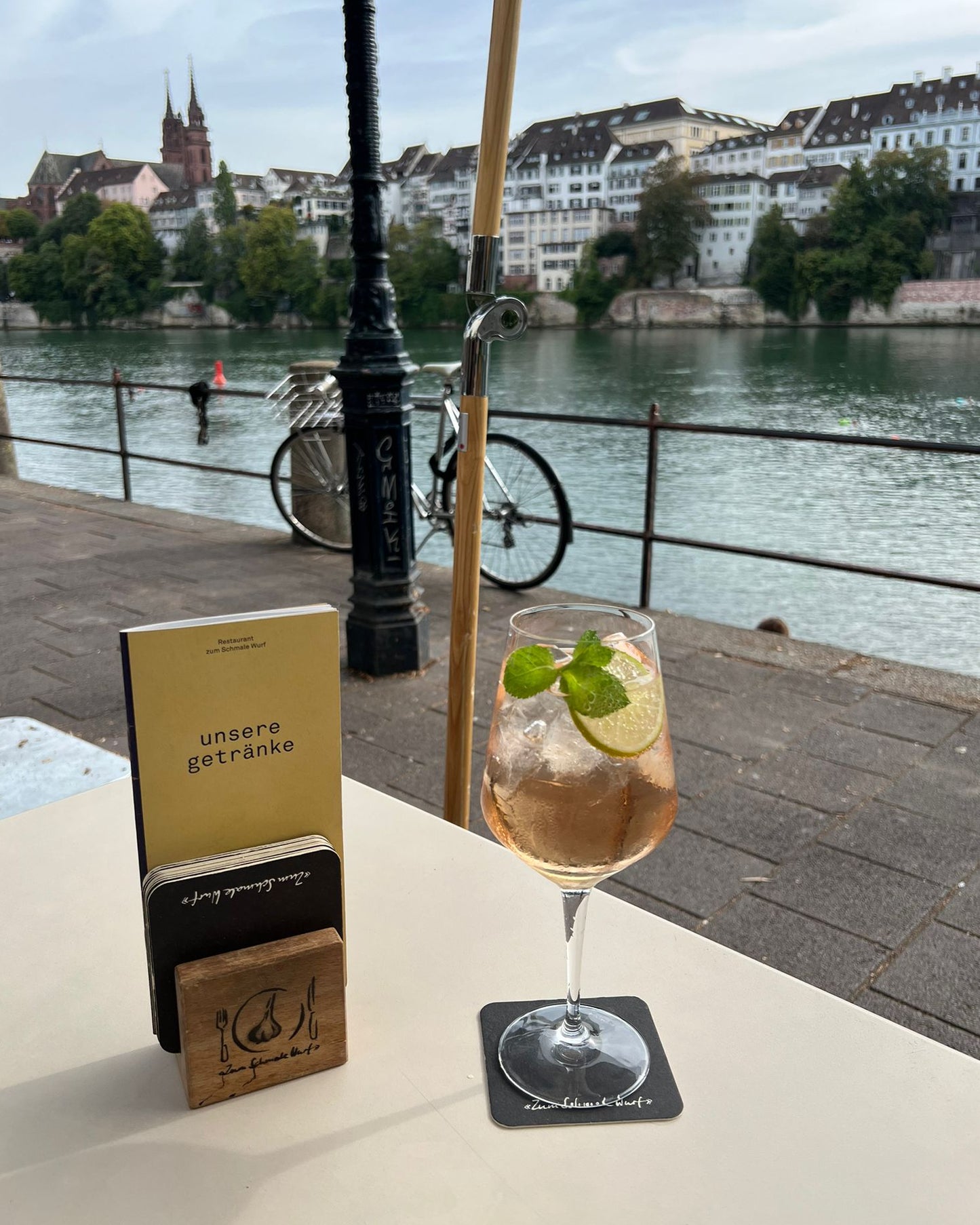 Book a table at Zum Schmale Wurf, a famous restaurant with Rhin river view in the city center (Basel, Switzerland)